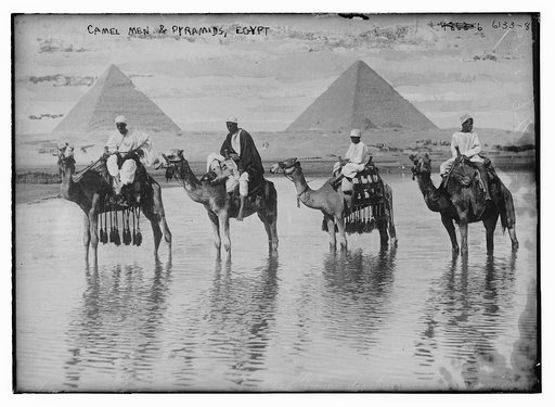 Camel men & pyramids, Egypt