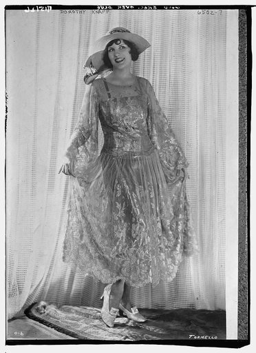 Dorothy Knapp wearing gold brocade over blue