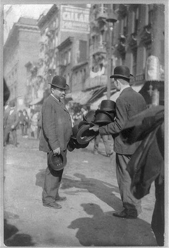 New York City street peddler; man peddling derby hats