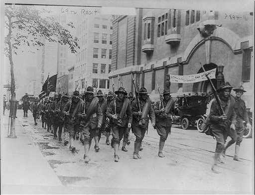 69th Regiment, New York National Guard, marching past armory entrance, New York City