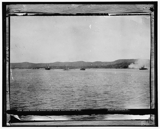 Landing marines and burning fishing village at Guantanamo, June 10, 1898
