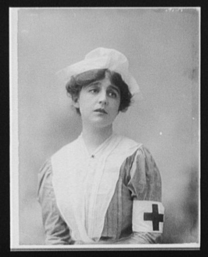 Woman in Red Cross nurse's uniform