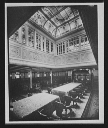 Dining room with stained glass skylight in ocean liner or steamship