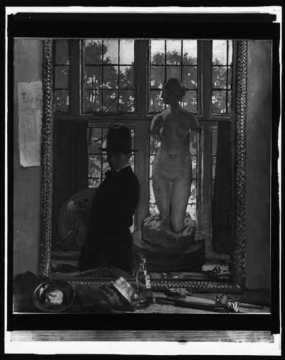 Artist with sculpture reflected in mirror