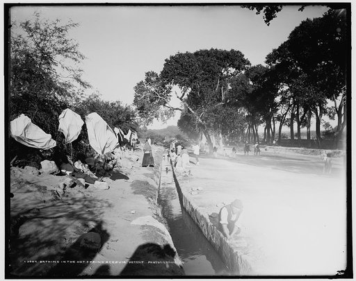 Bathing in the hot spring acequia