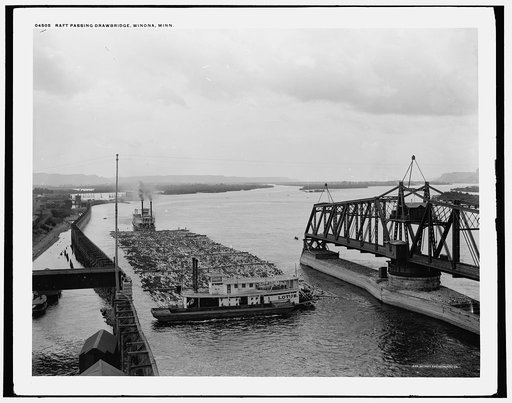 Raft passing drawbridge, Winona, Minn.
