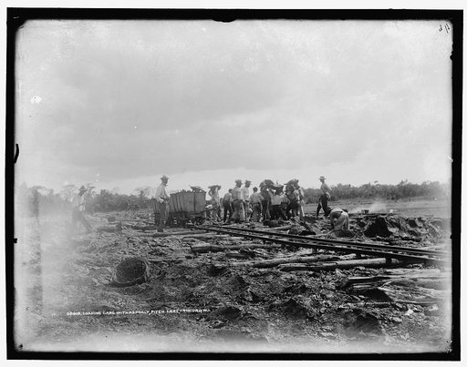 Loading cars with asphalt, Pitch Lake, Trinidad, W.I.