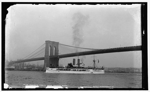 U.S.S. Maine passing under Brooklyn Bridge