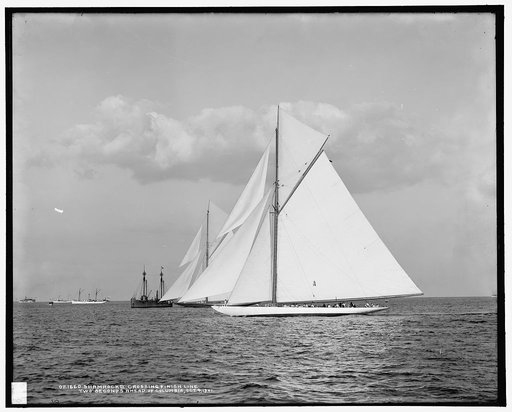 Shamrock II crossing finish line two seconds ahead of Columbia