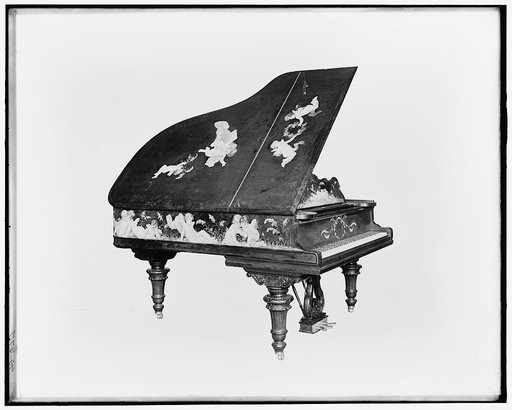 A Grand piano, cupids on cover