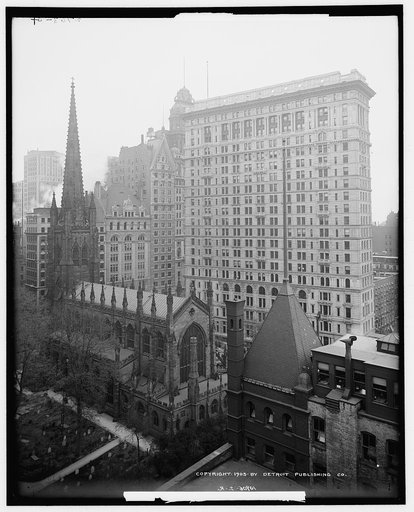 Sky scrapers overshadowing Trinity Church, New York