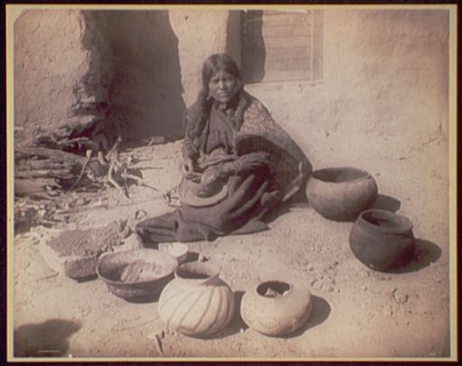 Hopi woman making pottery