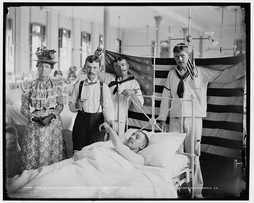 Taking a patient's pulse, Brooklyn Navy Yard Hospital