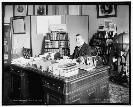 A Bureau official at his desk