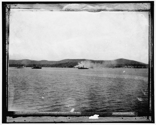 Landing Marines and burning fishing village at Guantanamo, June 10, 1898