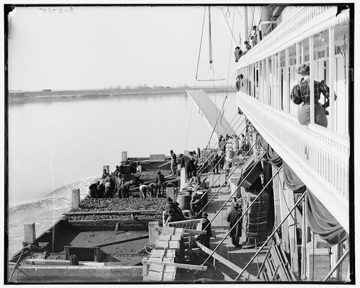 Coaling a river packet underway on Mississippi River