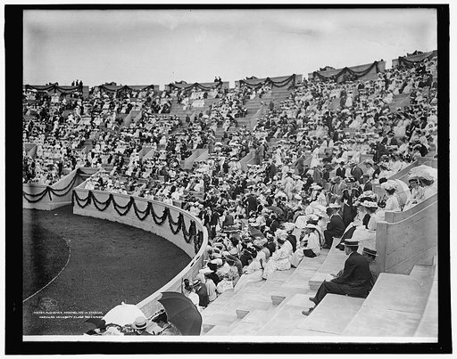 Audience assembling in stadium, Harvard University class day exercises