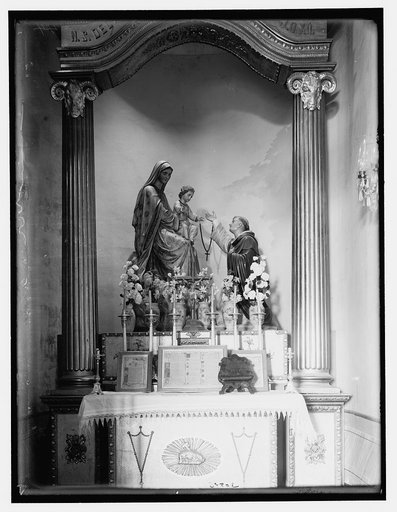 Saint with Madonna and child sculpture and altar piece
