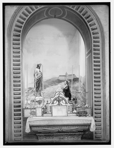 Altarpiece showing Christ appearing before a nun, with religious building in background
