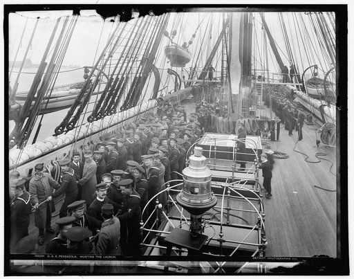 U.S.S. Pensacola, hoisting the launch