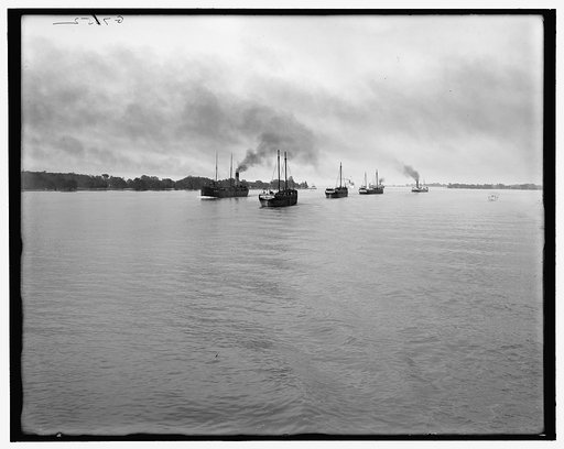 Tow passing Belle Isle light, Detroit, Mich.