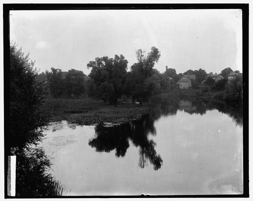 Waterscape with dwellings at right, probably the Huron River at Ypsilanti, Mich.