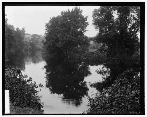 River with buildings in background, probably the Huron River, Ypsilanti, Michigan