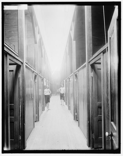 Two men in corridor, probably the Ypsilanti mineral bath house, Ypsilanti, Michigan