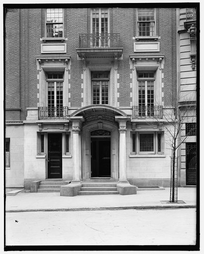 Four-story townhouse, entrance with pilasters and curved pediment, possibly New York, N.Y.