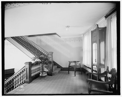 E.M. Bigsby Co. show rooms, clock on the balcony