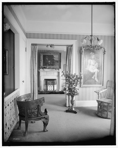 Room with painting of child, roses, and portiere