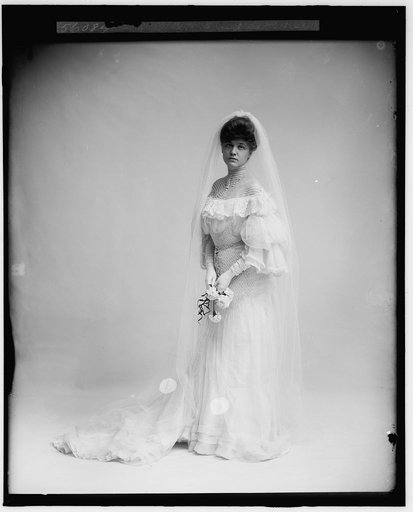 Woman in wedding dress holding flowers