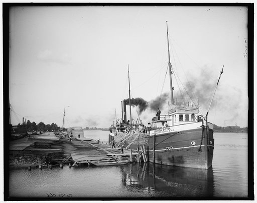 Unloading lumber, Saginaw, Mich.