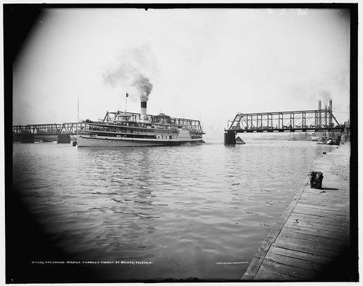 Greyhound passing through Cherry St. [Street] bridge, Toledo