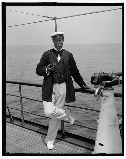 Man posed with nautical equipment on ship deck