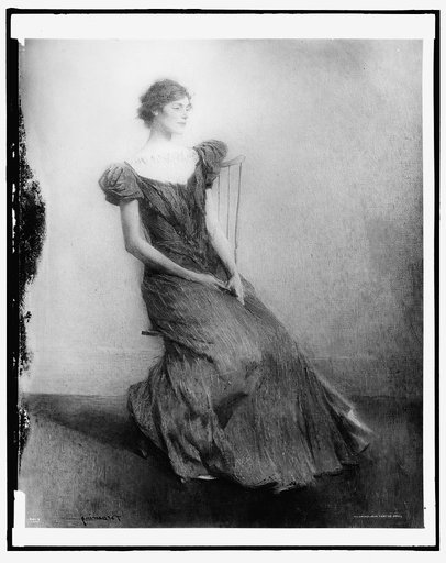 Young woman seated in chair
