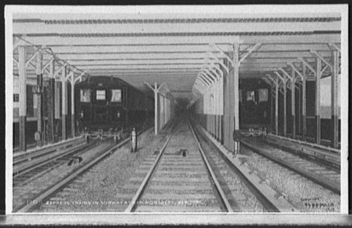 Express trains in subway at Spring Street, New York