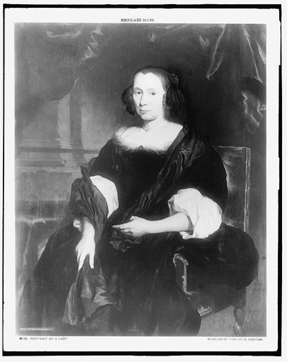 Woman seated in chair, three-quarter-length portrait