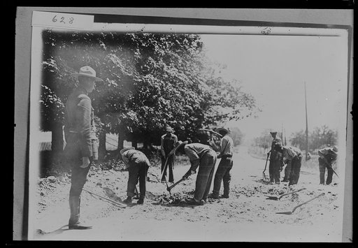 Highway construction crew, probably Michigan State Highway Dept., digging, Michigan