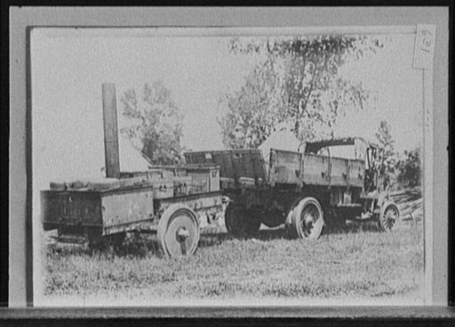 Highway construction truck and supplies, probably Michigan State Highway Dept., Michigan