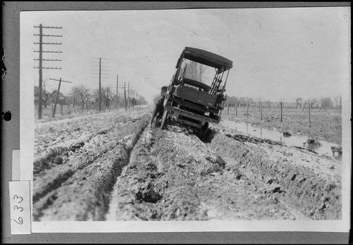 Truck in rutted road, possibly road construction in Michigan