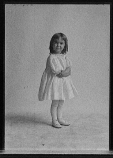 Girl standing with crossed arms