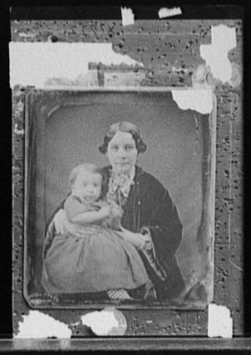 Woman with baby girl, possibly mother and daughter