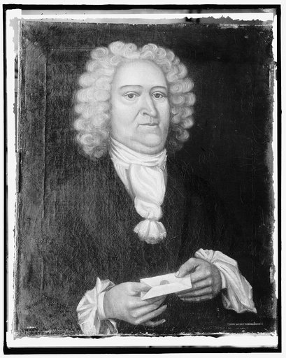 Man in wig holding letter, head and shoulders portrait