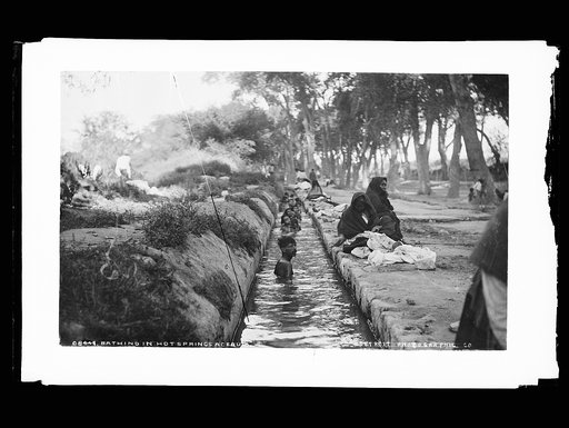 Bathing in the hot springs acequia