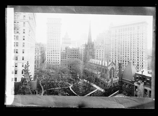 Sky scrapers overshadowing Trinity Church, New York