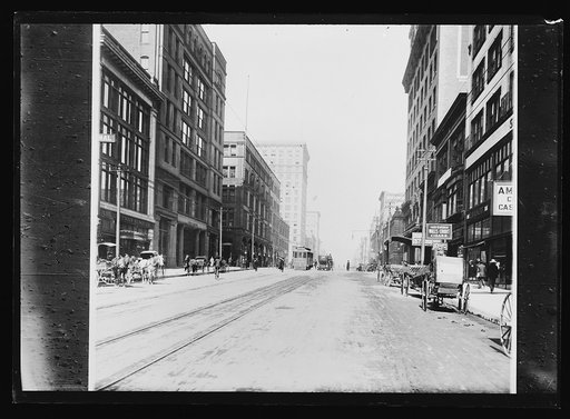 Street with commercial buildings, possibly Missouri