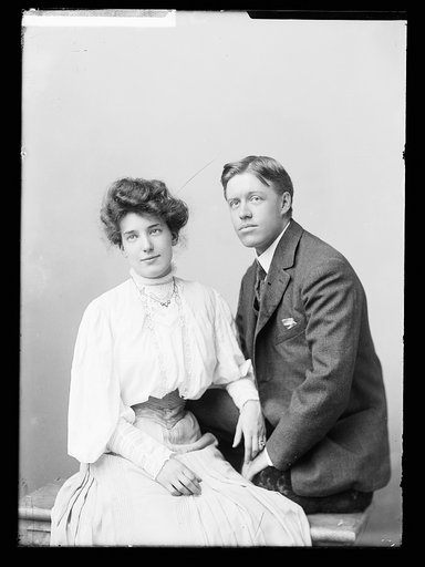 Clarence S. Jackson and wife, seated, three-quarter-length portrait