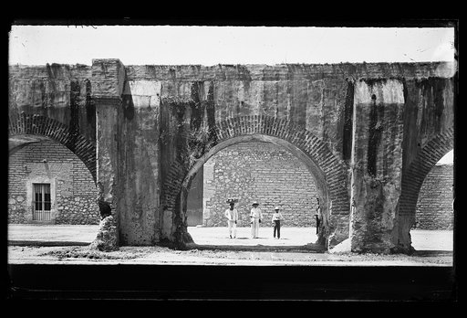 Group of cargadores by old aqueduct, Mexico City, Mexico