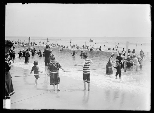 Children playing with rope, beach, possibly Atlantic City, N.J.